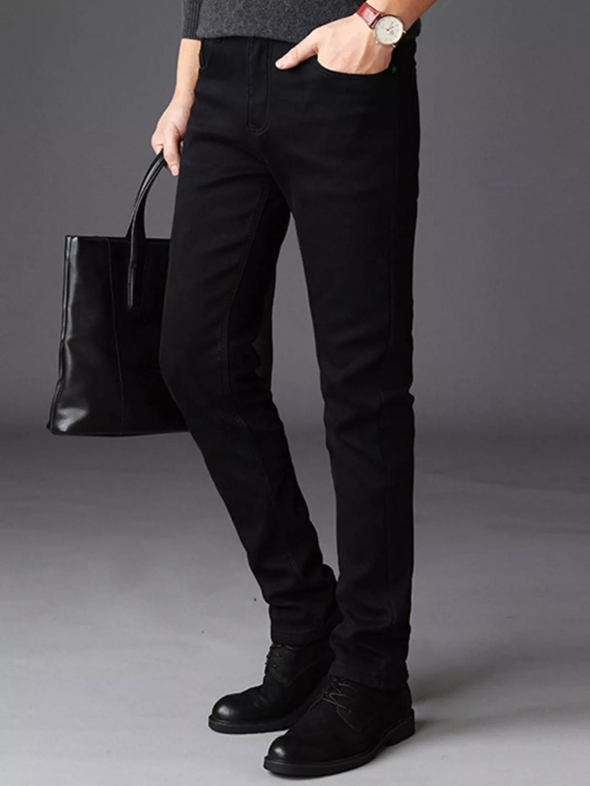 Black slim-fit stretch cotton jeans with zip fly, belt loops, and five-pocket style