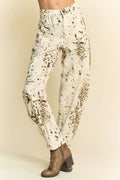 Cream barrel-leg pants with abstract black dot tie-dye print and tapered cuffs