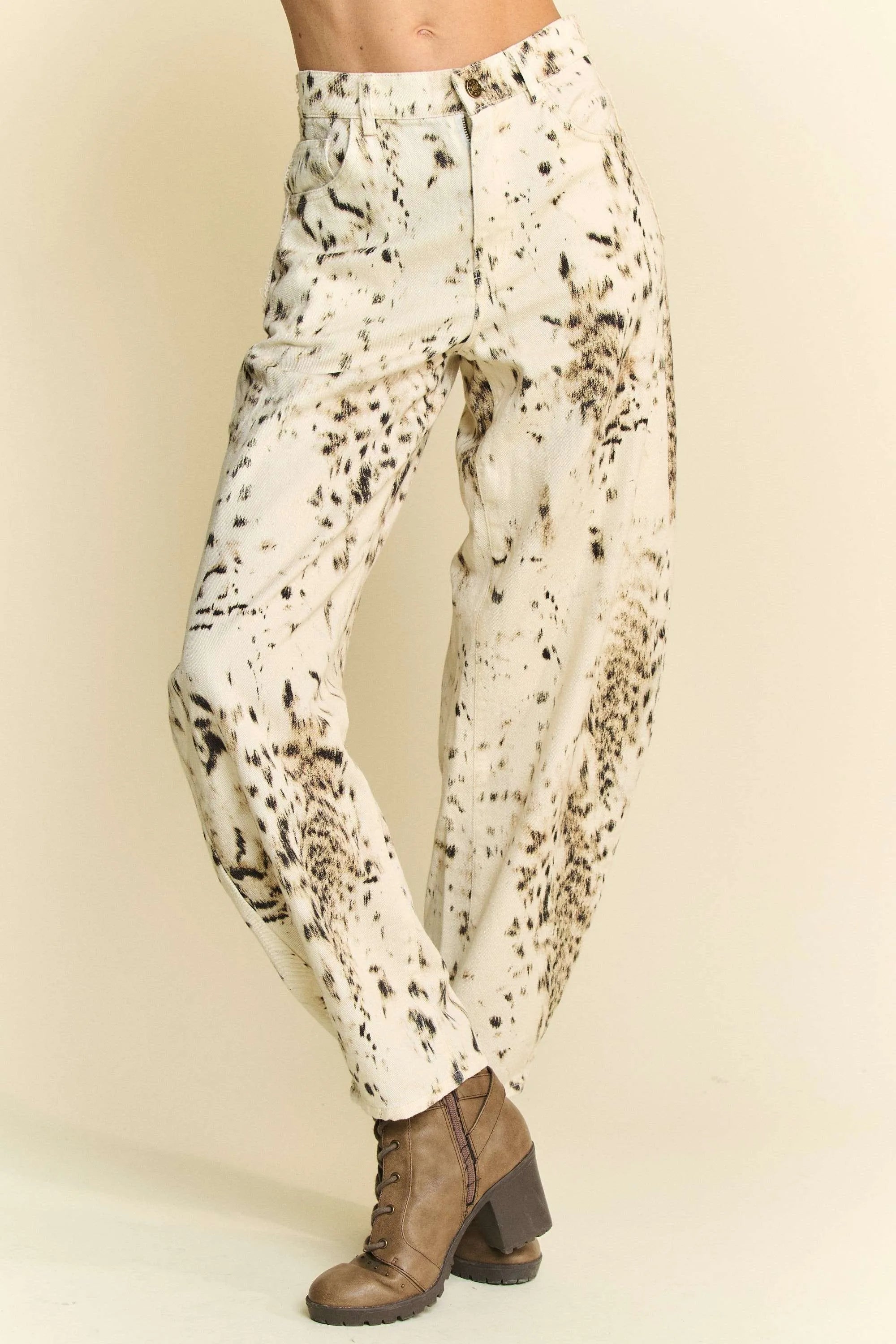 Cream barrel-leg pants with abstract black dot tie-dye print and tapered cuffs