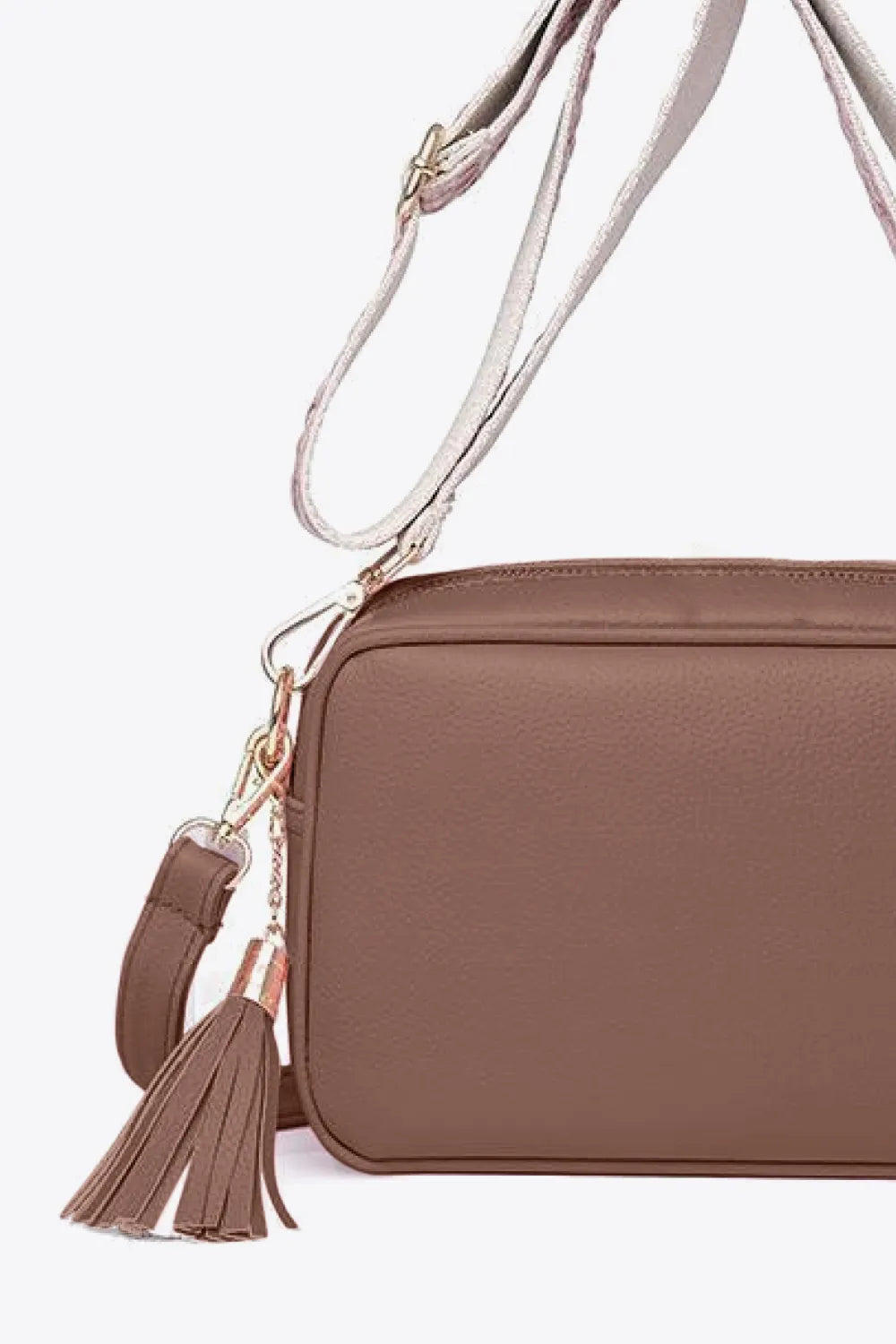 PU leather tassel crossbody bag, mauve-brown side view with tassel charm and shoulder strap