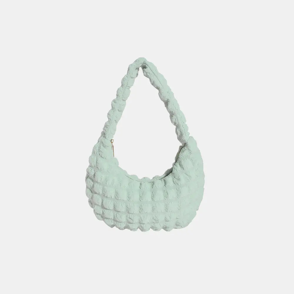 Light green textured small hobo handbag with braided shoulder strap