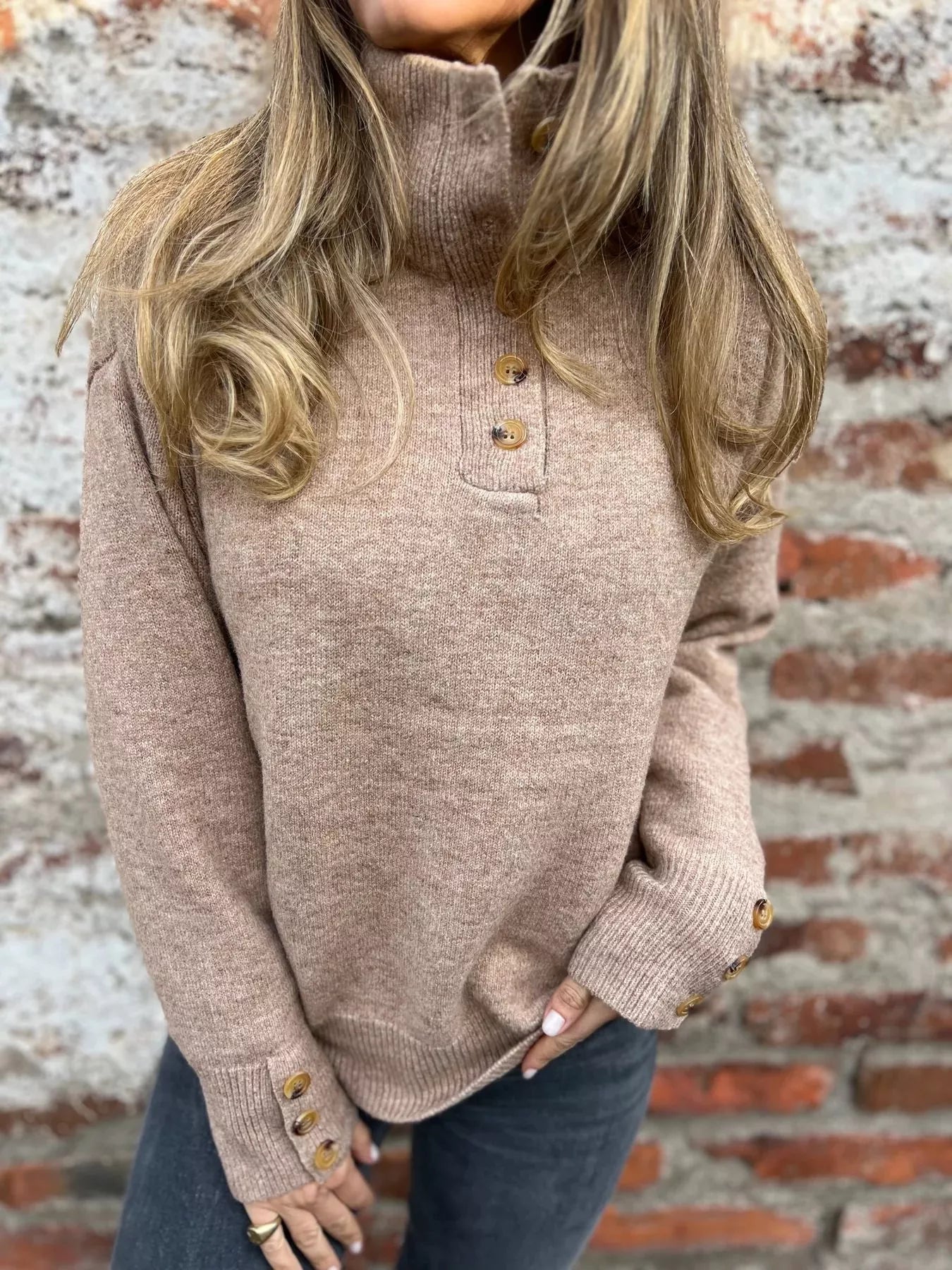 Khaki turtleneck sweater with front buttons and long sleeves, gold-tone cuff buttons