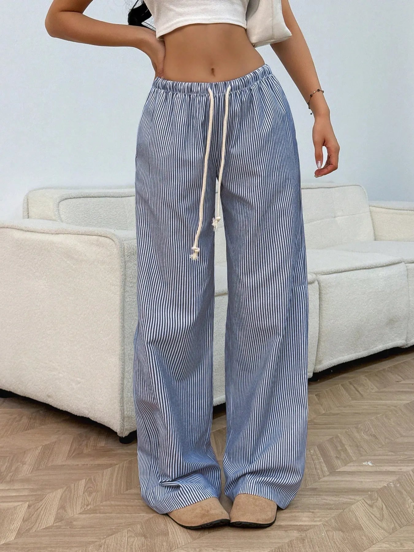 Light blue striped wide-leg pants with elastic waist and drawstring ties