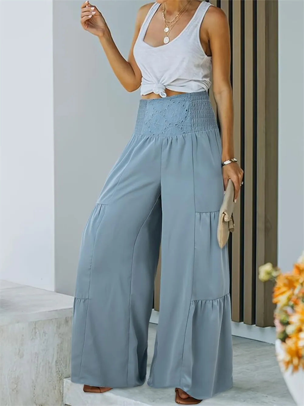 Light blue smocked high-waist wide-leg pants with cargo-style side pocket