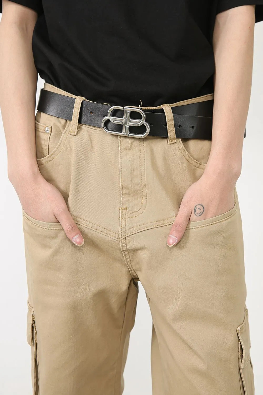 Men's khaki cargo baggy jeans with belt loops and front patch pocket detail