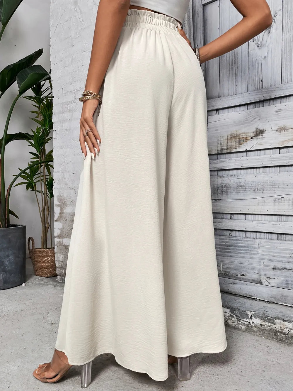 Cream high waist wide-leg pants with elastic waistband and drawstring ties