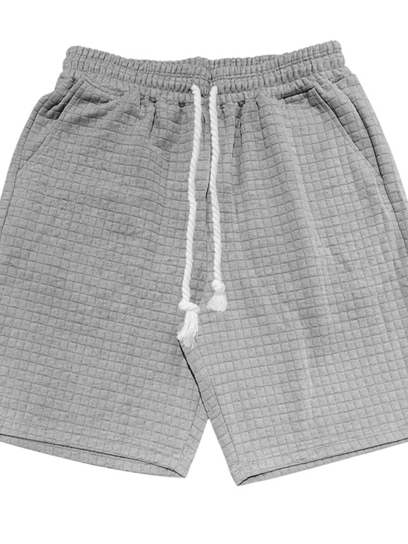 Light gray drawstring shorts with elastic waistband and side seam pockets