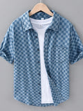Light blue checkered short-sleeve casual shirt with button-front and spread collar