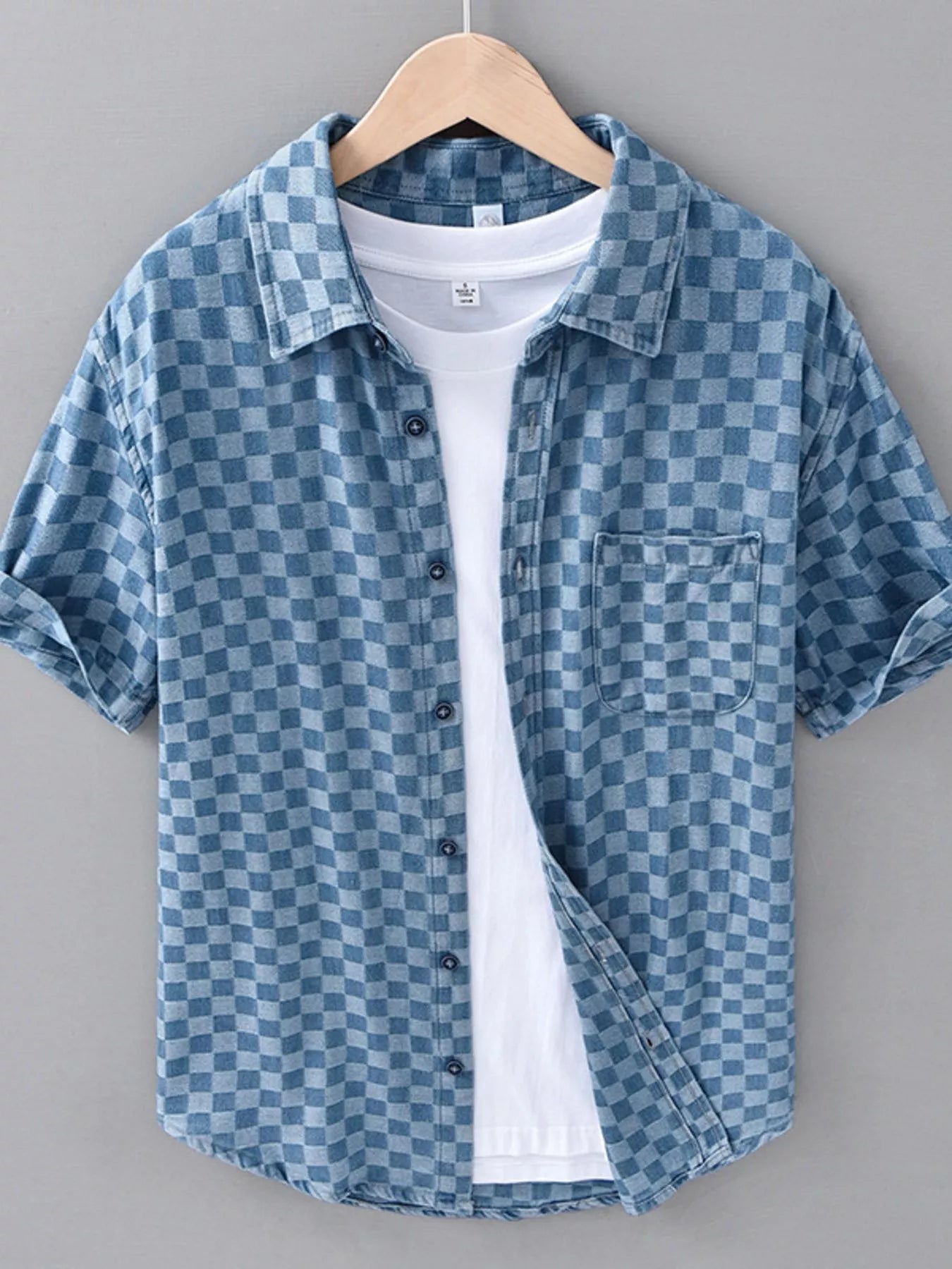 Light blue checkered short-sleeve casual shirt with button-front and spread collar
