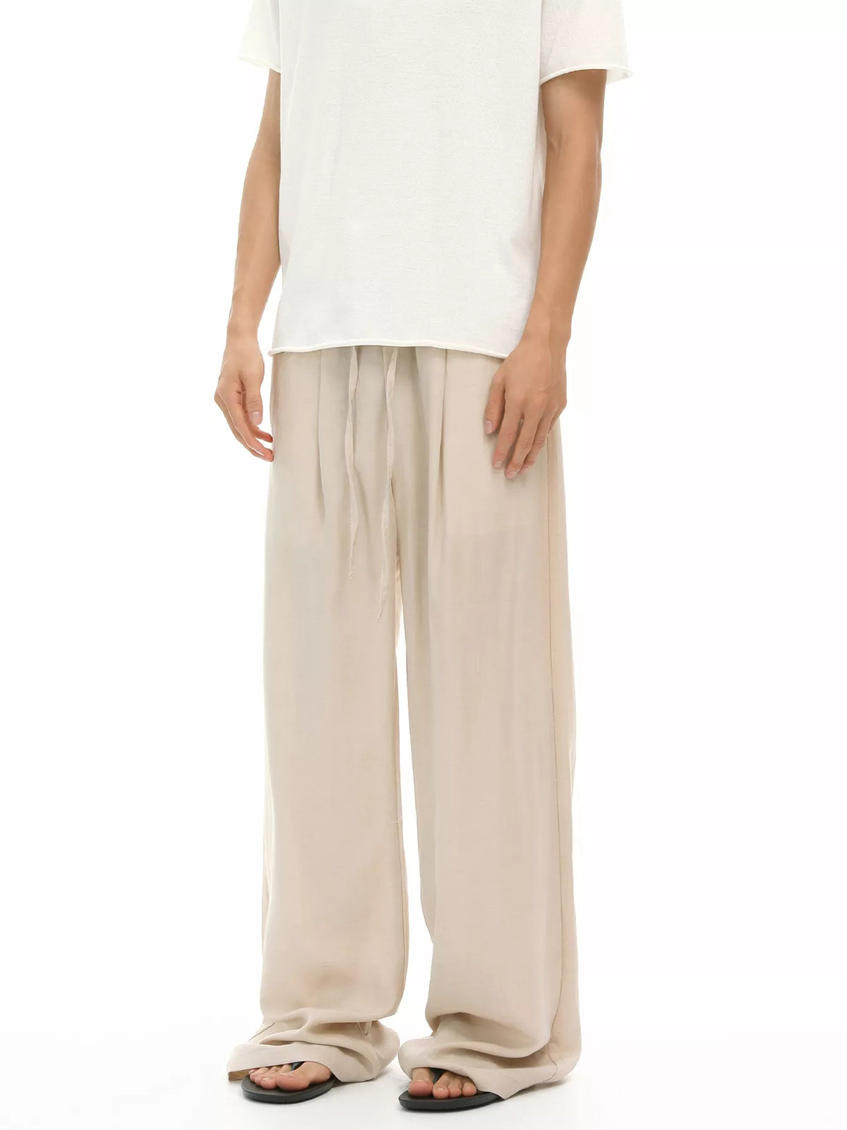 Khaki wide-leg drawstring pants with loose fit and gathered waistband