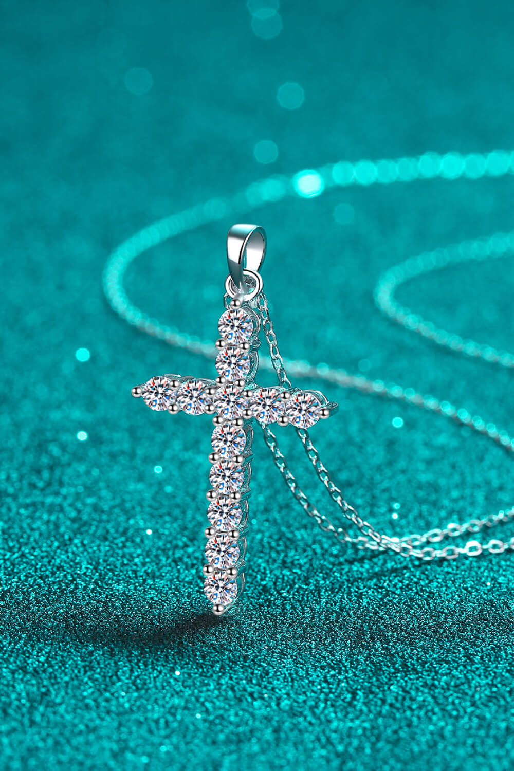 Silver moissanite cross pendant with pavé stones and chain loop