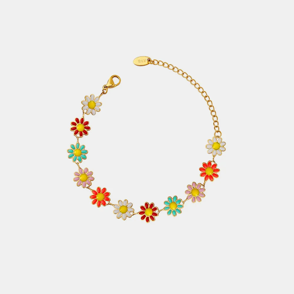 Gold enamel flower bracelet with small multicolor blossoms along a thin chain