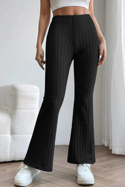 Ribbed high-waist flare pants in black, full-length front view with wide bell legs.