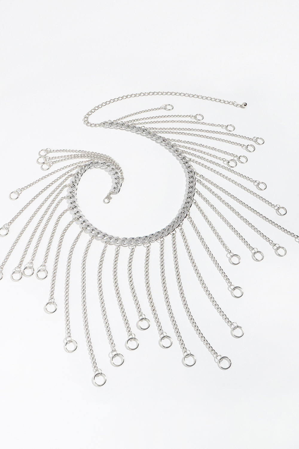 Silver chain fringe belt detail with oval ring center and multiple dangling loops