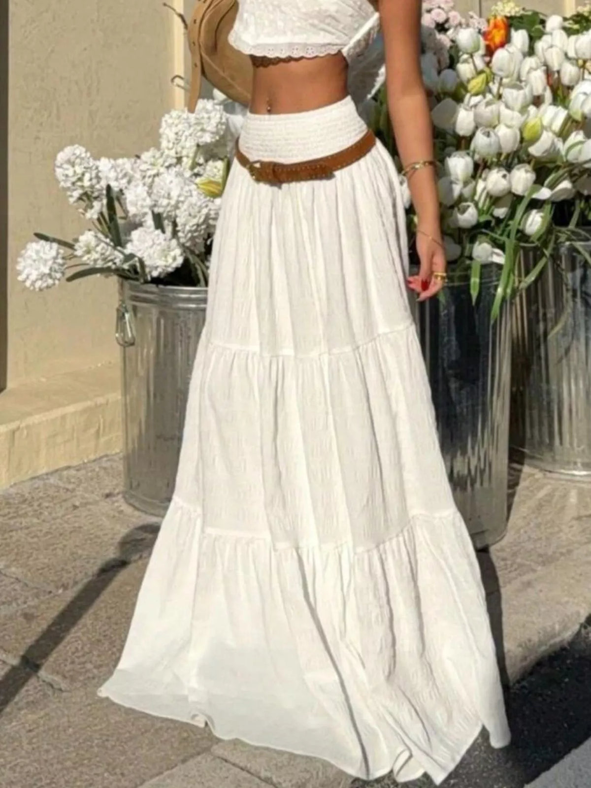 White tiered flowy maxi skirt with smocked waistband and ruffled tiered hem