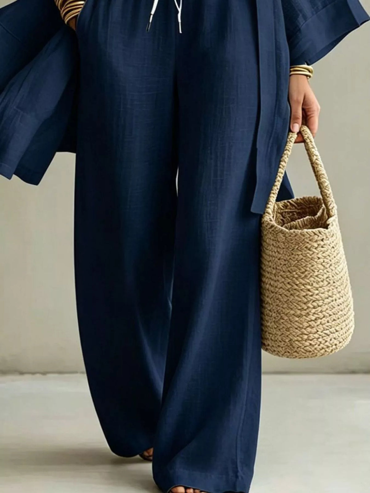 Navy wide-leg drawstring pants with matching open cardigan; three-piece outfit set detail