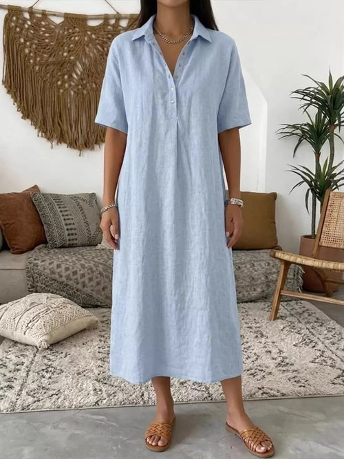 Light blue button-detail half-sleeve dress with v-neck placket, midi length