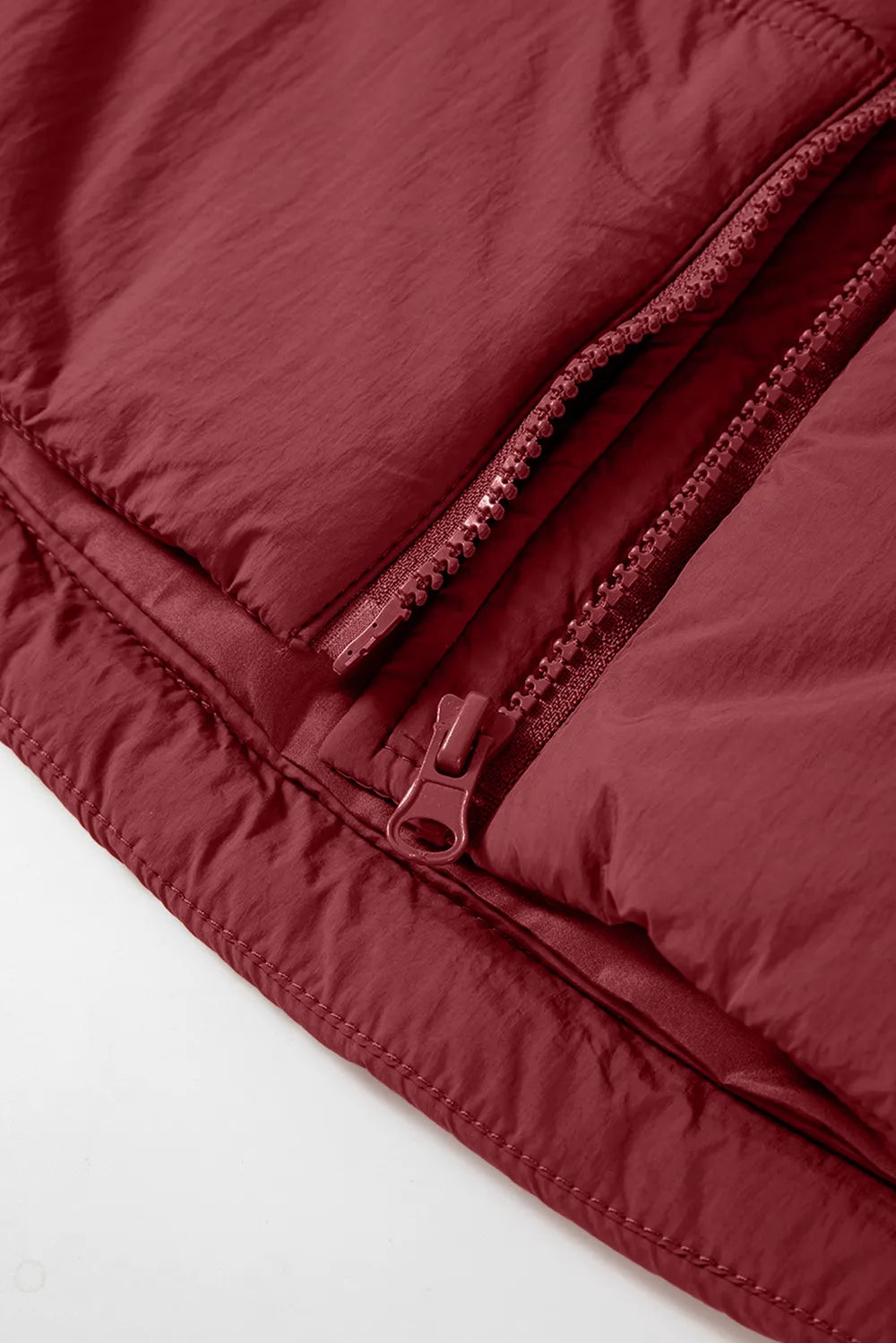 Burgundy zippered front of hooded vest coat with double zippers and snap trim