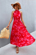 Printed tie-waist maxi dress in red with pink floral pattern, sleeveless