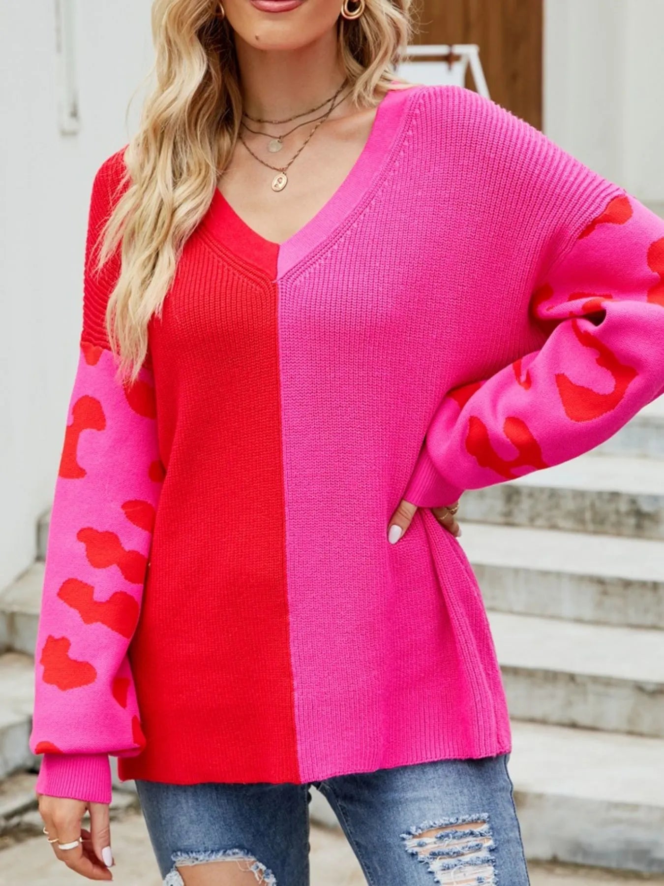V-neck sweater with red side panel, hot pink body, leopard-print sleeves