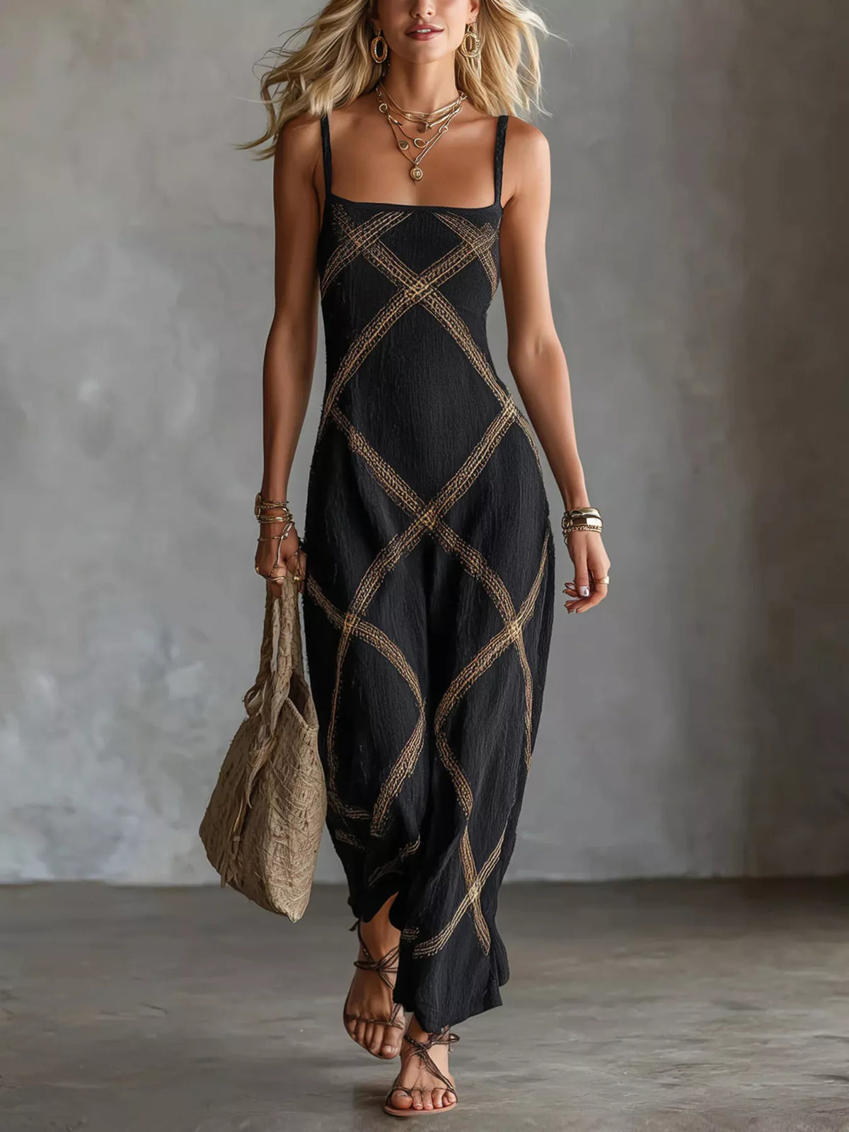 Black square-neck maxi dress with spaghetti straps, featuring gold diamond lattice print