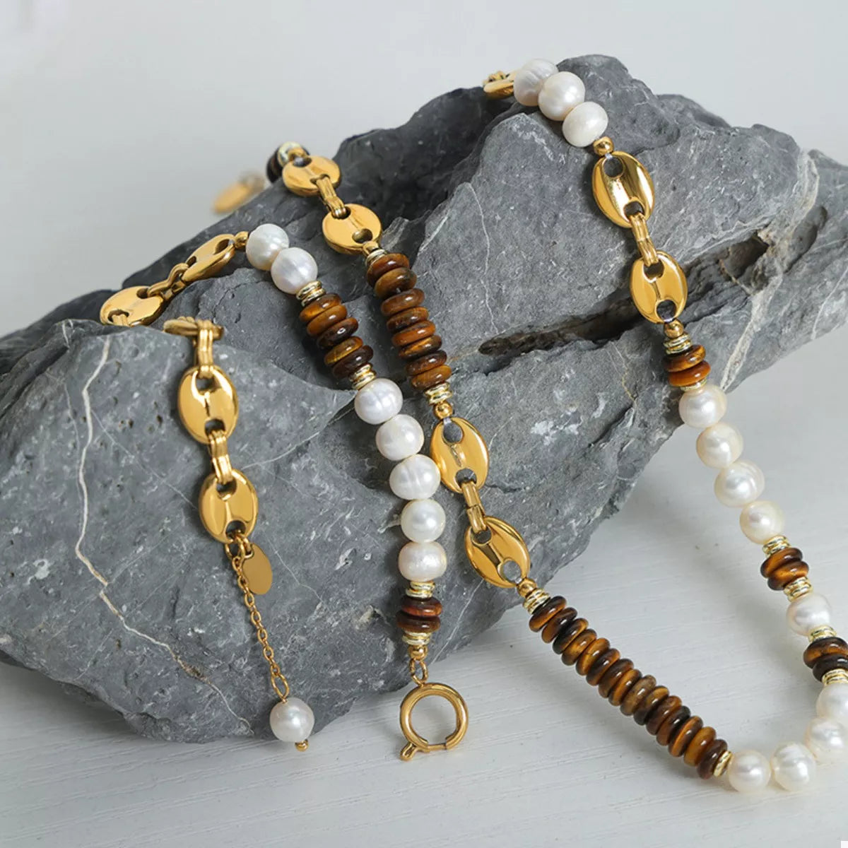 Freshwater pearl and tiger eye bead necklaces with gold oval and toggle links