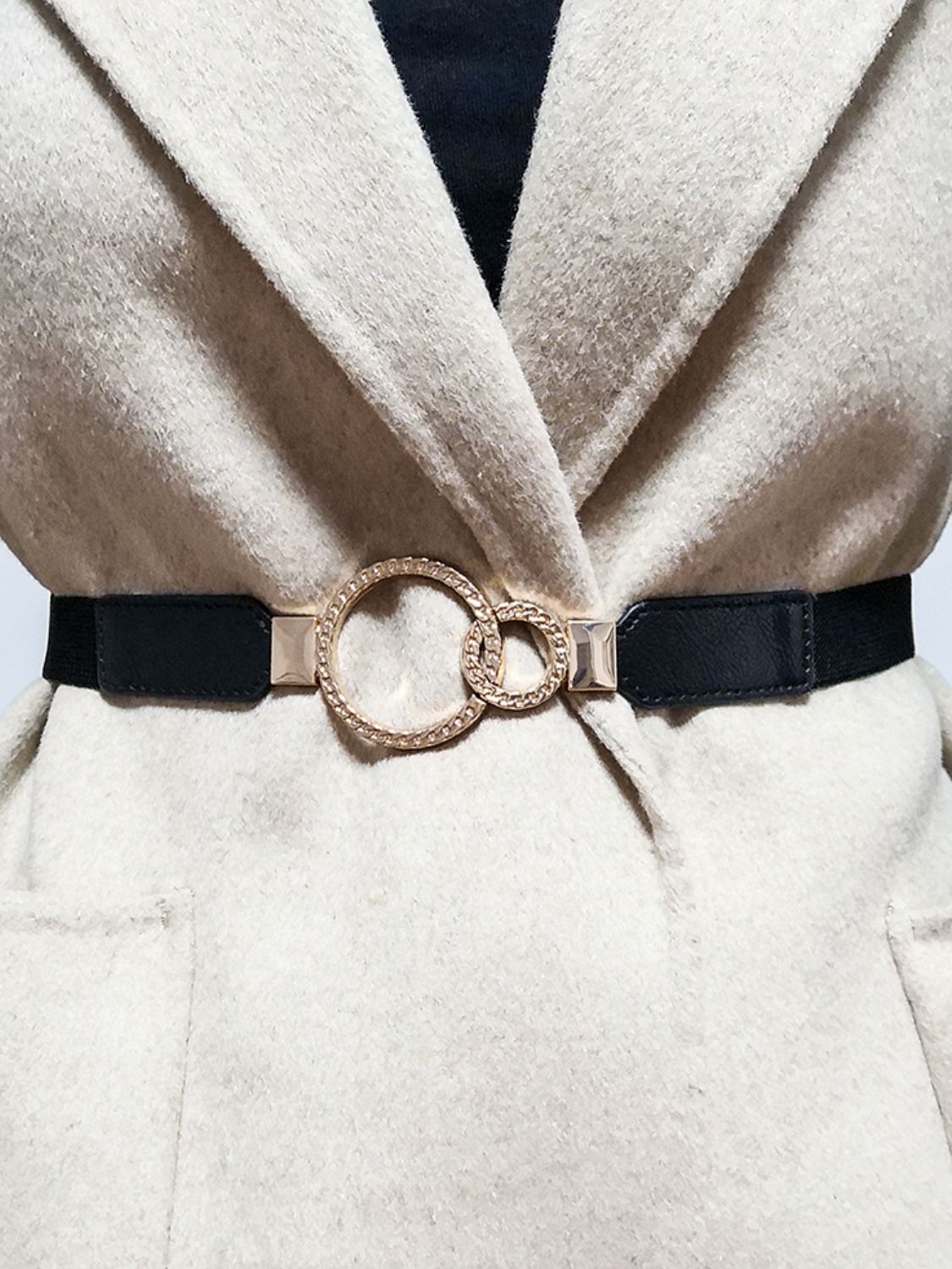 Black elastic vegan leather belt with large double-ring buckle and rectangular tabs