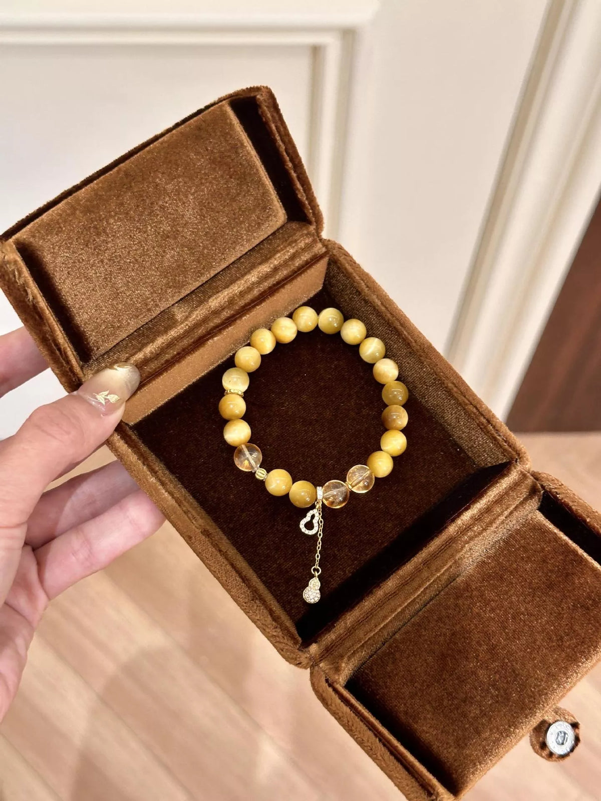 Beaded bracelet in gift box, round amber beads with gourd charm drop