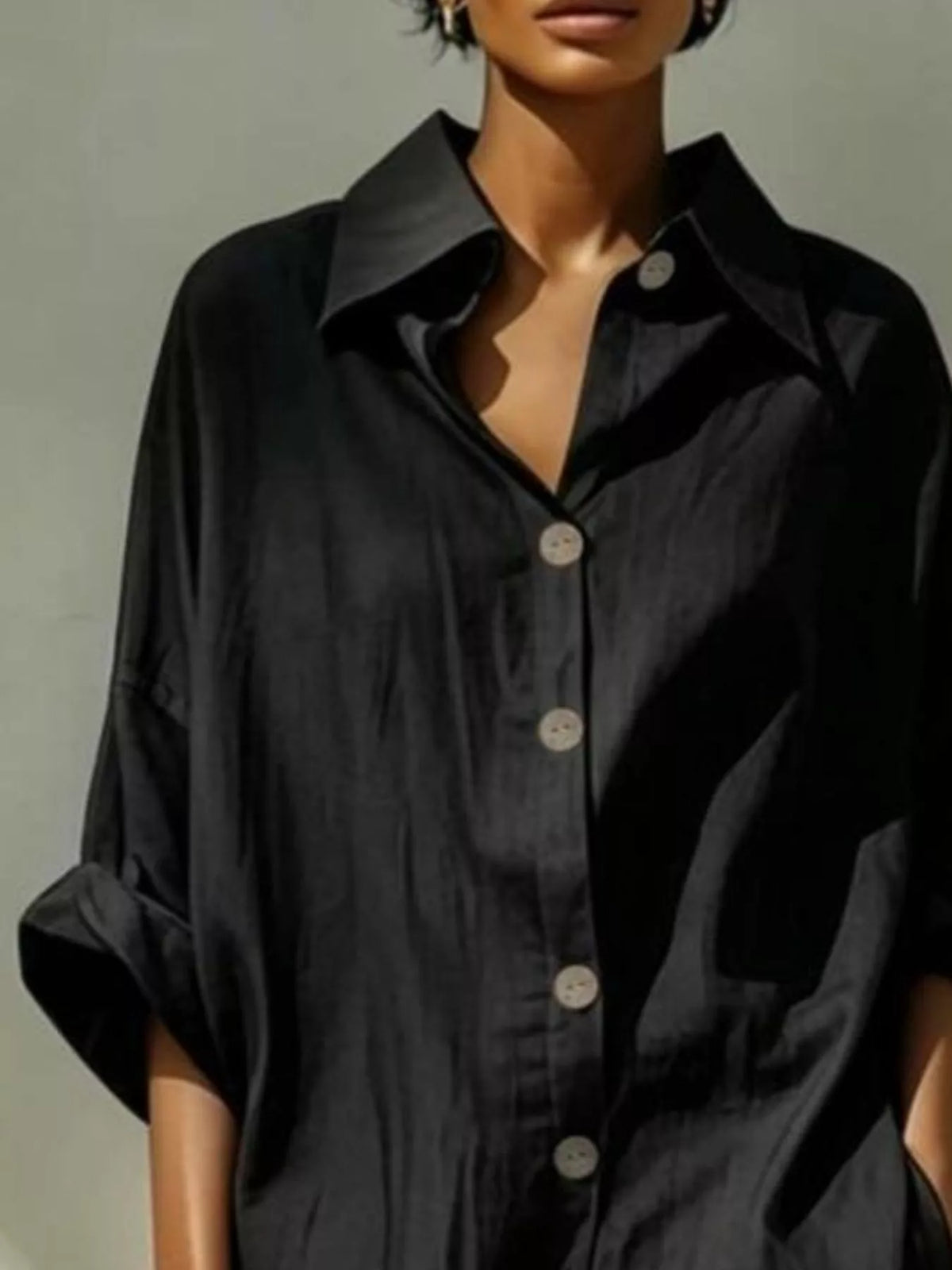 Black collared shirt dress with button placket and loose short sleeves