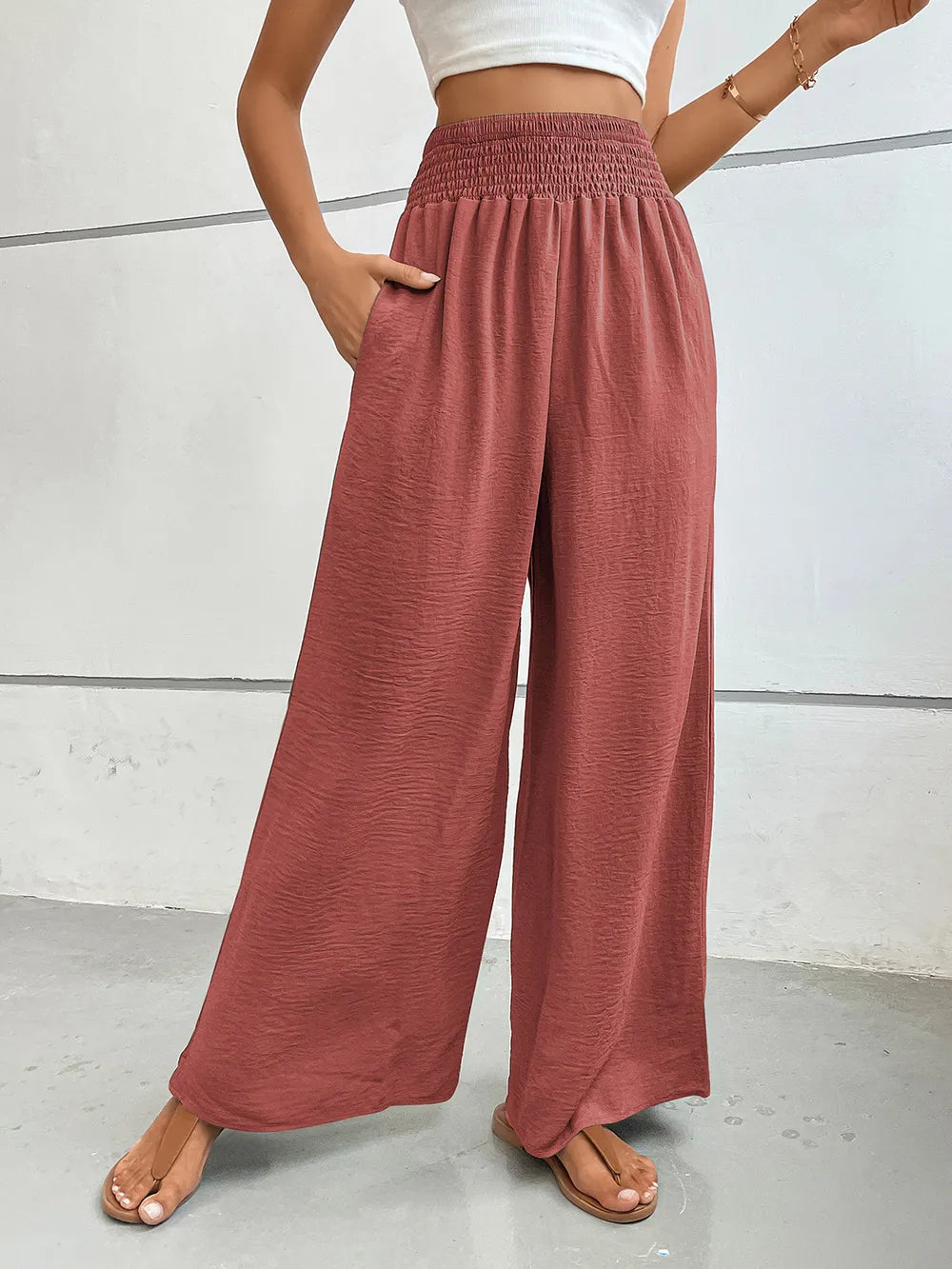 Burgundy wide-leg pants with elastic waist and side pockets