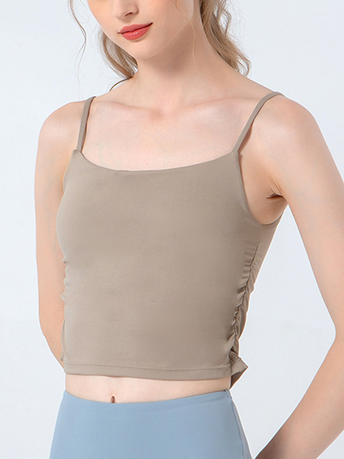 Beige ruched sports cami with spaghetti straps and scoop neckline