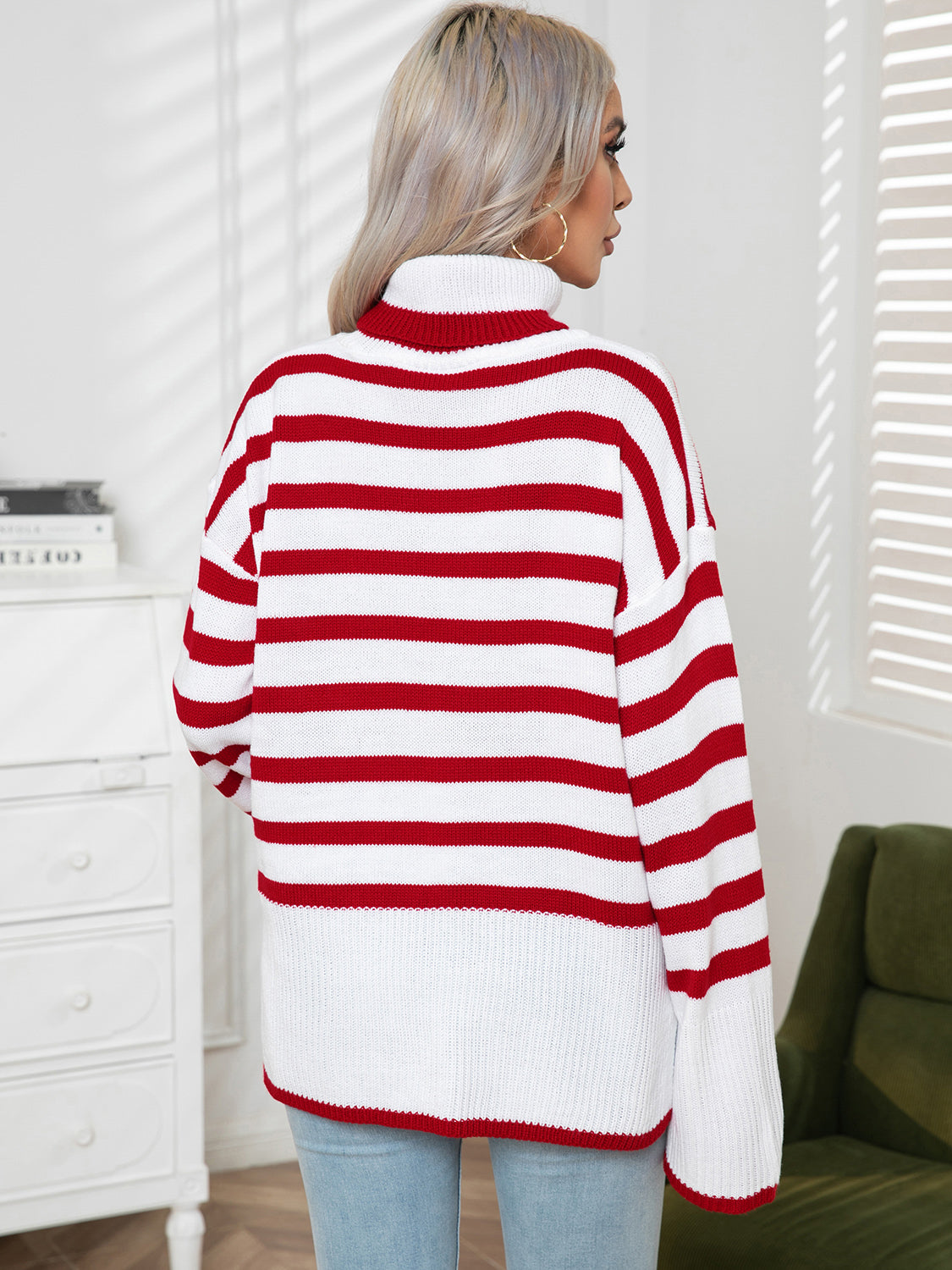 Red-and-white striped turtleneck sweater shown from the back, drop-shoulder style