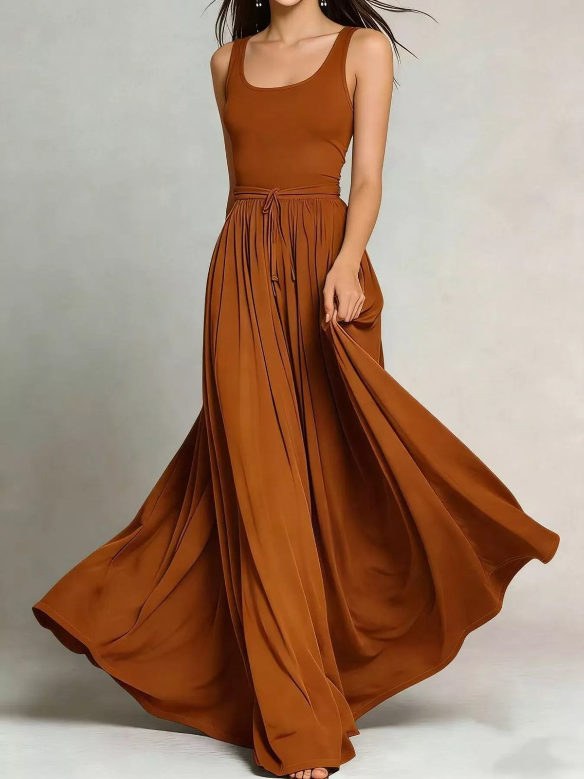 Terracotta sleeveless maxi dress with drawstring waist and flowing gathered skirt