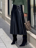 Black vegan leather midi skirt with ruching and double buckles at waistband