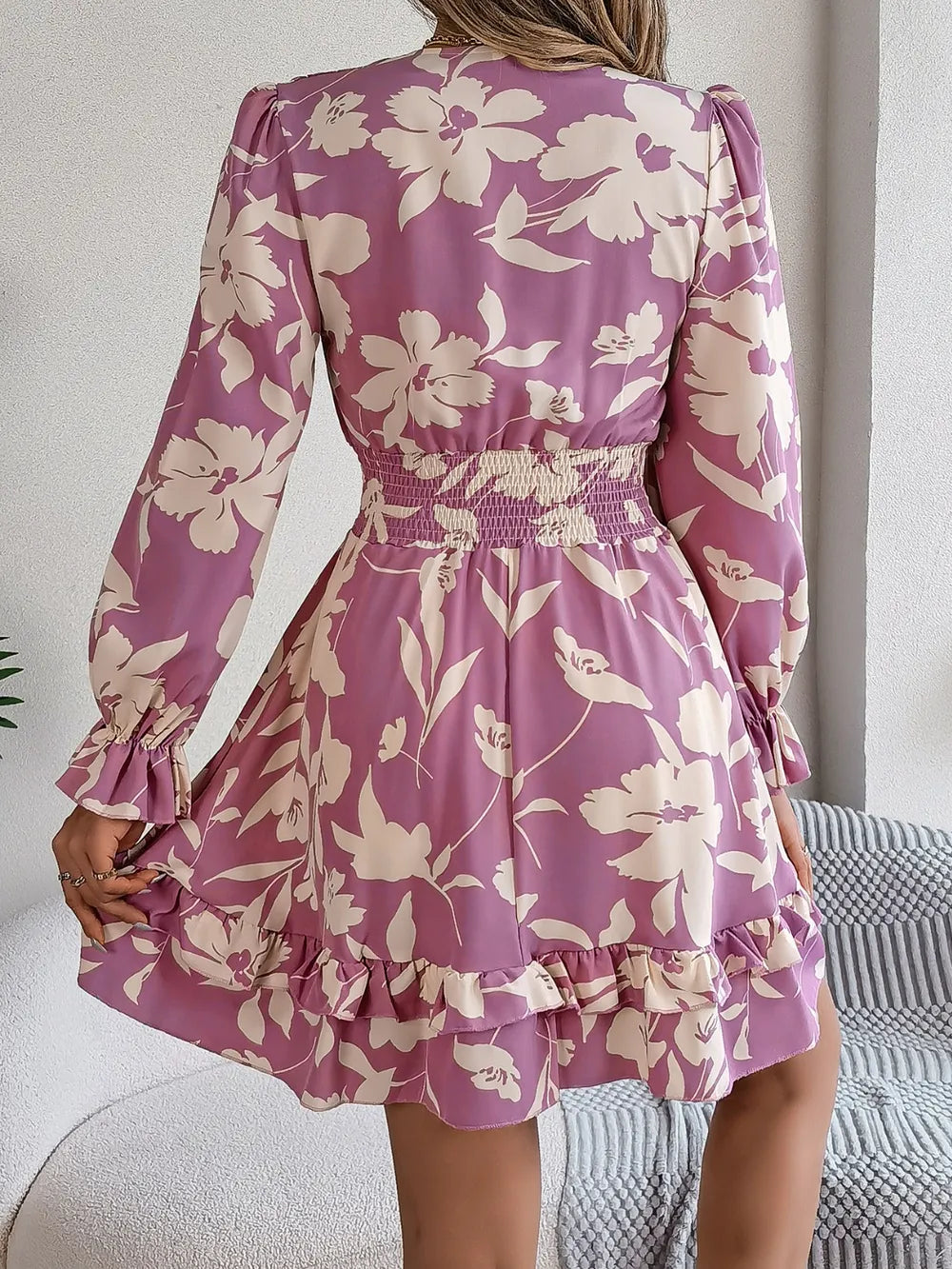 Lilac floral long-sleeve dress with tie-front V-neck and ruffled back hem