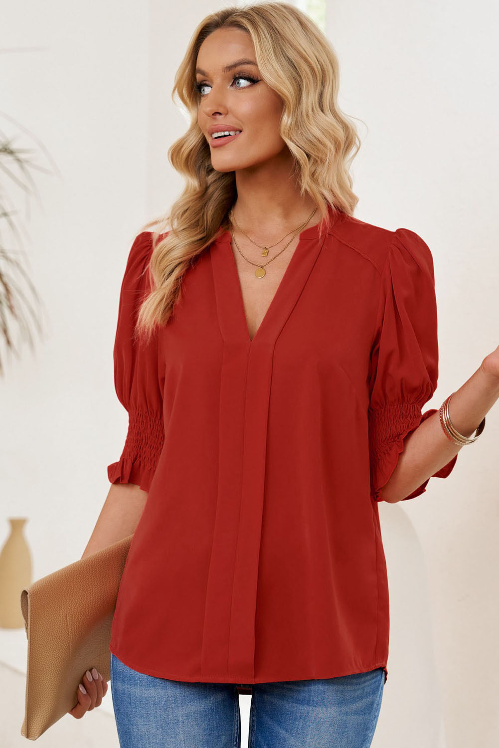 Smocked flounce sleeve blouse with notched V-neck, deep red puff sleeves and pleated front