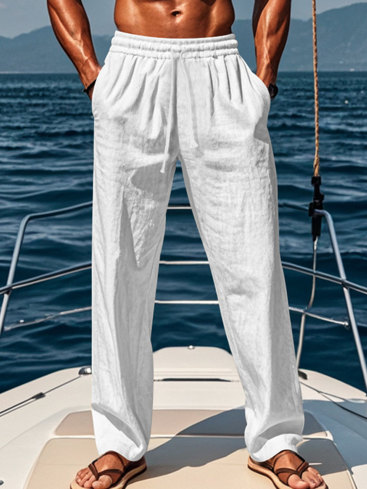 Men's loose-fit drawstring pants in white with elastic waistband and full-length fit