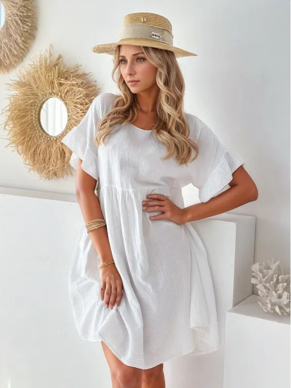 Round neck white mini dress, short sleeves, loose-fit by Trendsi.