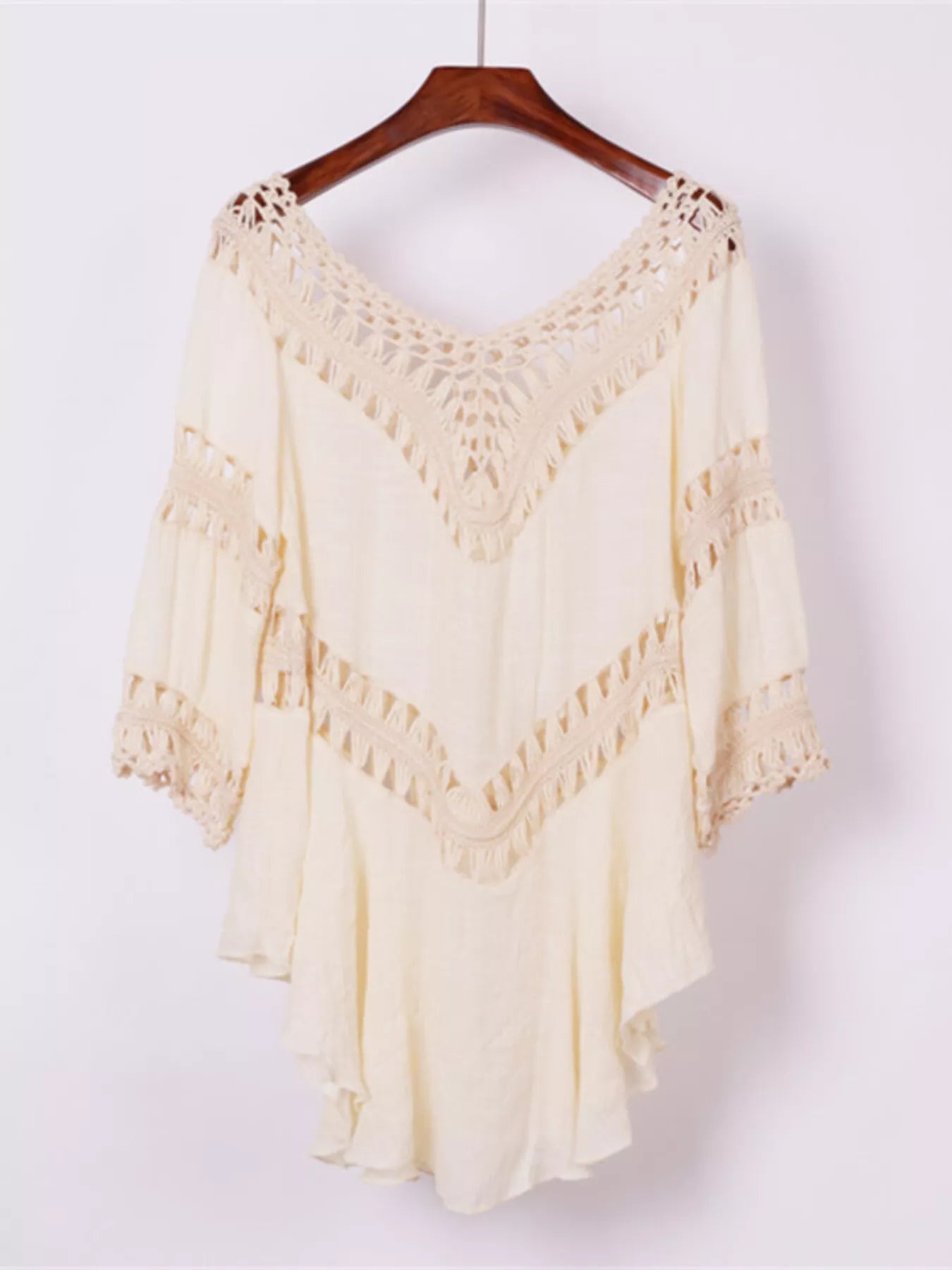 Apricot crochet-trimmed flowy cover up dress on hanger with V-shaped openwork yoke