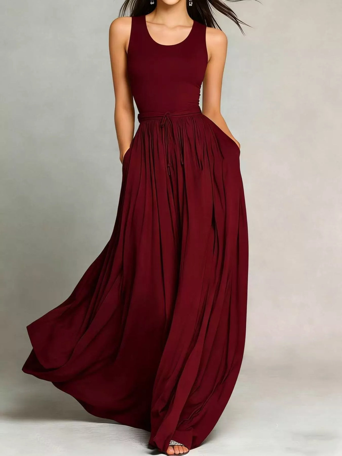 Burgundy sleeveless maxi dress with drawstring waist and flowing gathered skirt
