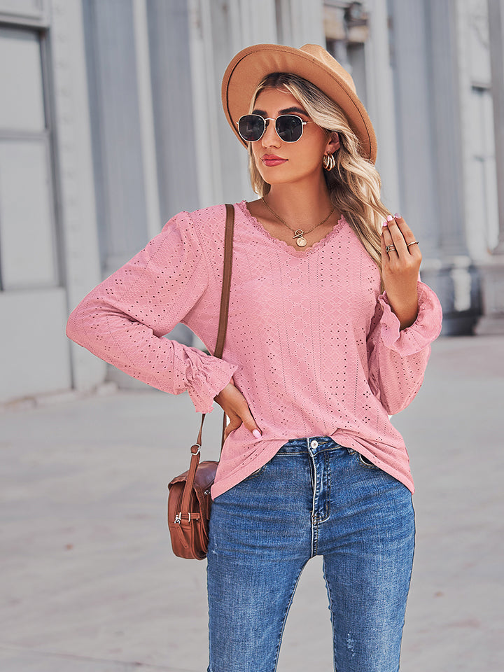 Blush pink eyelet V-neck blouse with flounce cuffs and V-neck detail, side view