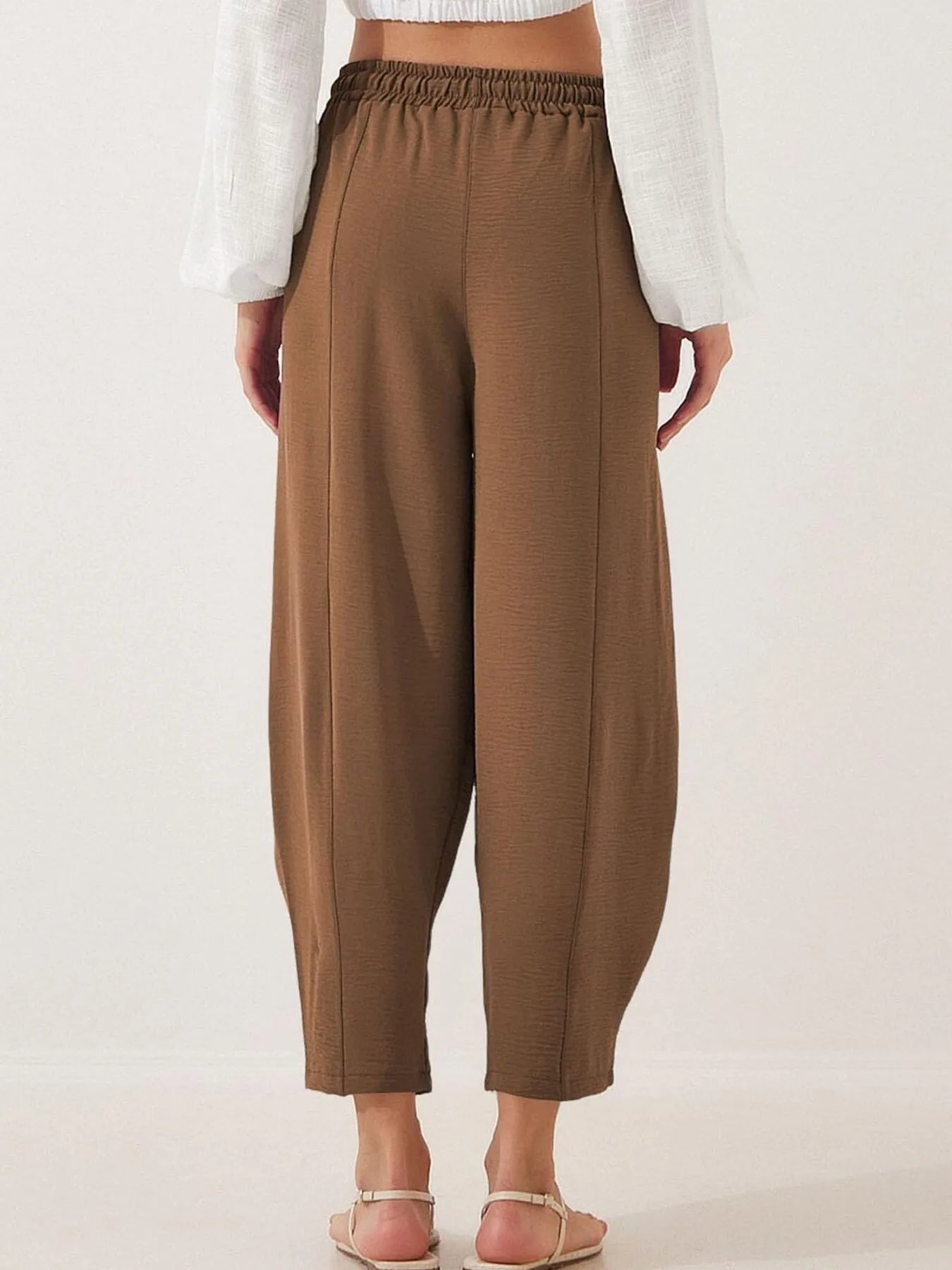 Cropped wide-leg pants in dark brown with elastic waist and drawstring