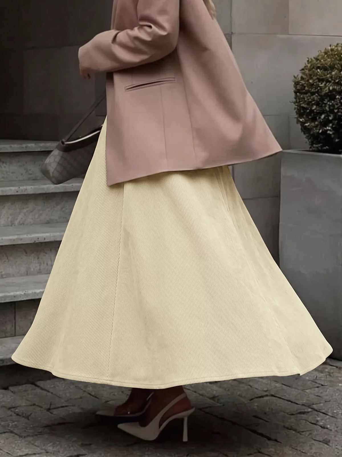 Khaki pleated midi skirt with high waist and front zipper, A-line silhouette
