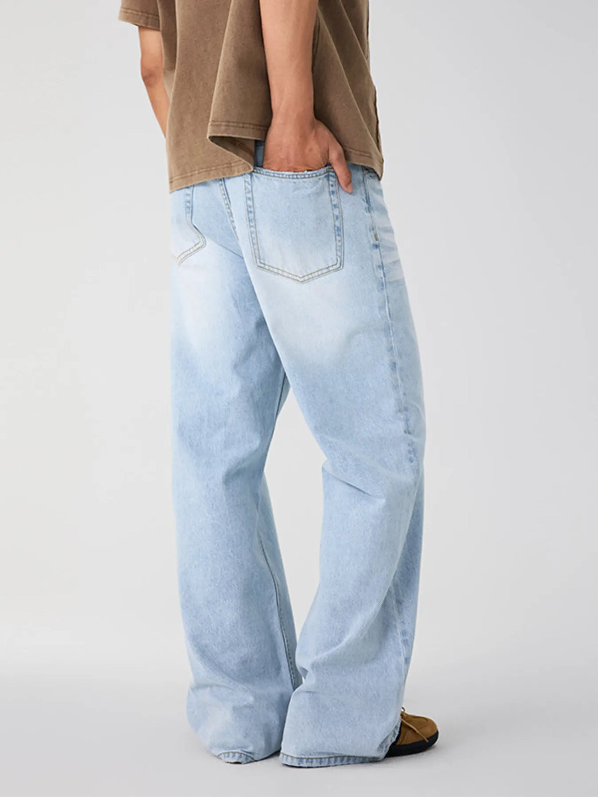 Glacier blue washed denim jeans with back patch pocket and relaxed wide leg