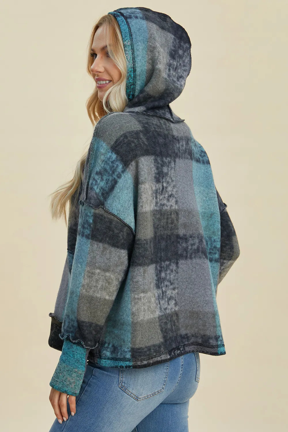 Plaid fleece hoodie with hood, dropped shoulders, dark gray and blue tones, long sleeves.