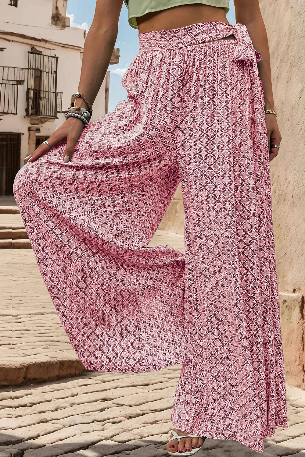Pink printed wide-leg pants, tied elastic waist, loose drape with wide pant legs