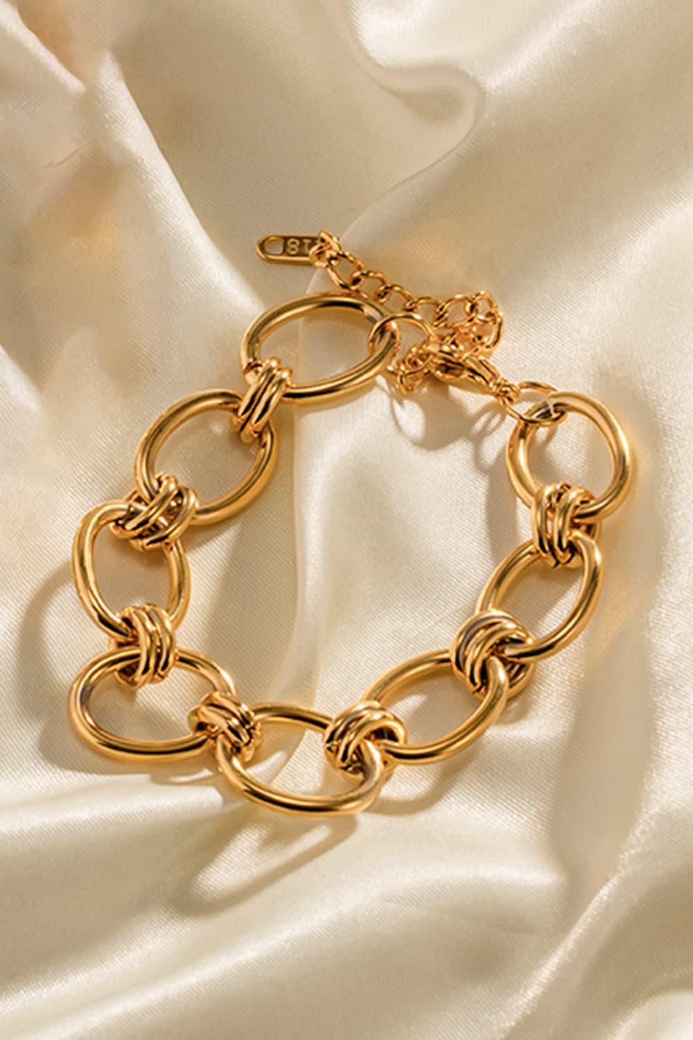 Gold chunky chain bracelet with oval links and oval ring clasp detail