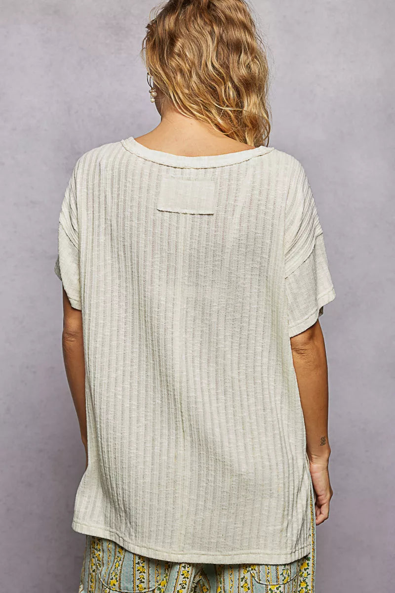 Cedar & Moore POL ribbed knit v-neck short sleeve t-shirt with side slit, beige back view.