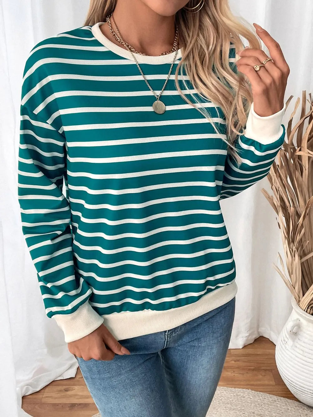 Turquoise and white striped long-sleeve sweatshirt with round neck and contrast cuffs