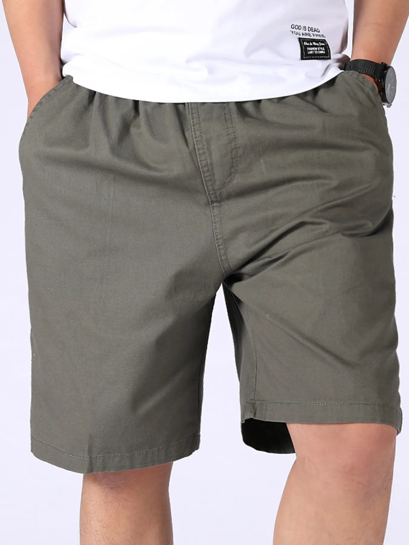 Men's plus-size olive pocketed shorts with zip fly, belt loops, and side pockets